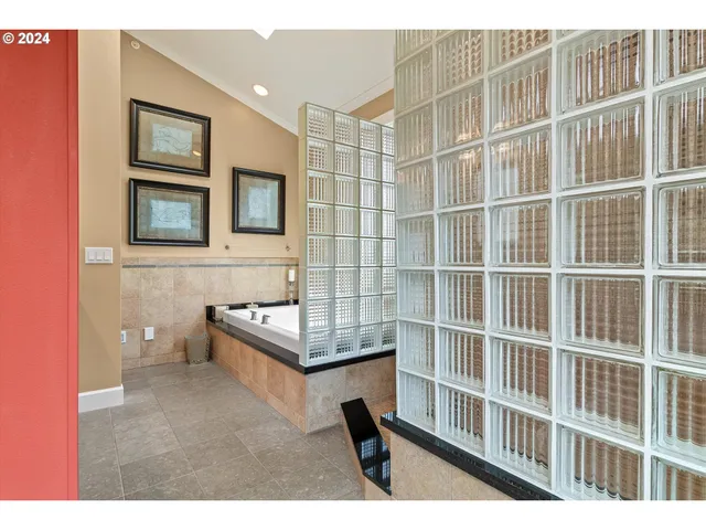 a kitchen view of a refrigerator and cabinets