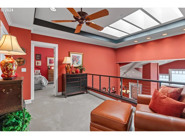 a living room with furniture a flower pot and a chandelier