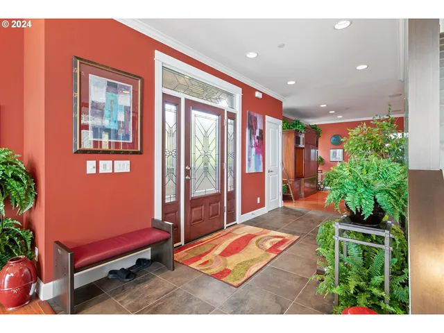a balcony with furniture and a potted plant