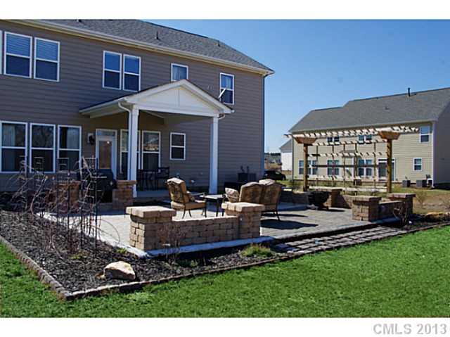 1705 Ridgehaven Road, Unit 230 Waxhaw, NC 28173 - Photo 3 of 16 a view of a house with pool table and chairs