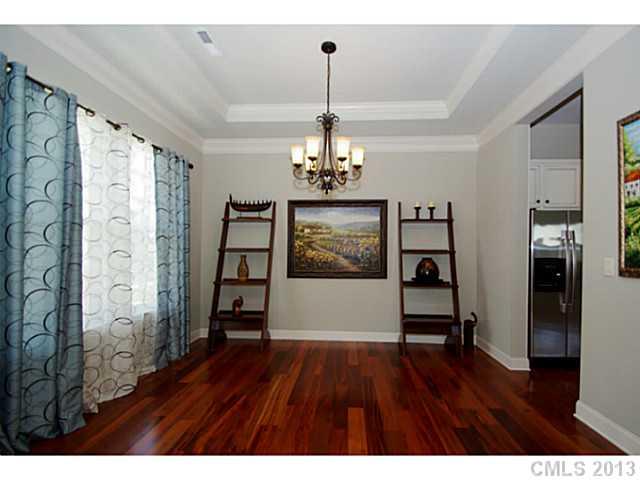 1705 Ridgehaven Road, Unit 230 Waxhaw, NC 28173 - Photo 4 of 16 a view of a room with wooden floor chandelier and entryway