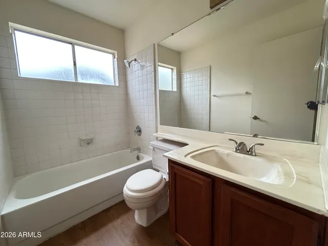a bathroom with a sink a toilet and bathtub