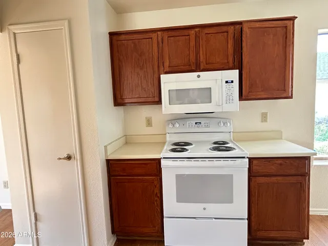 a kitchen with a stove and a microwave