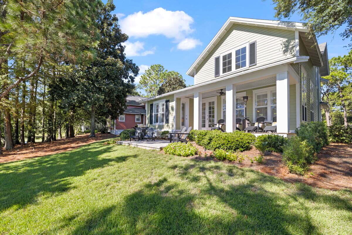 1281 Laurel Way Miramar Beach, FL 32550 - Photo 33 of 46 a view of house with yard outdoor seating and covered with trees