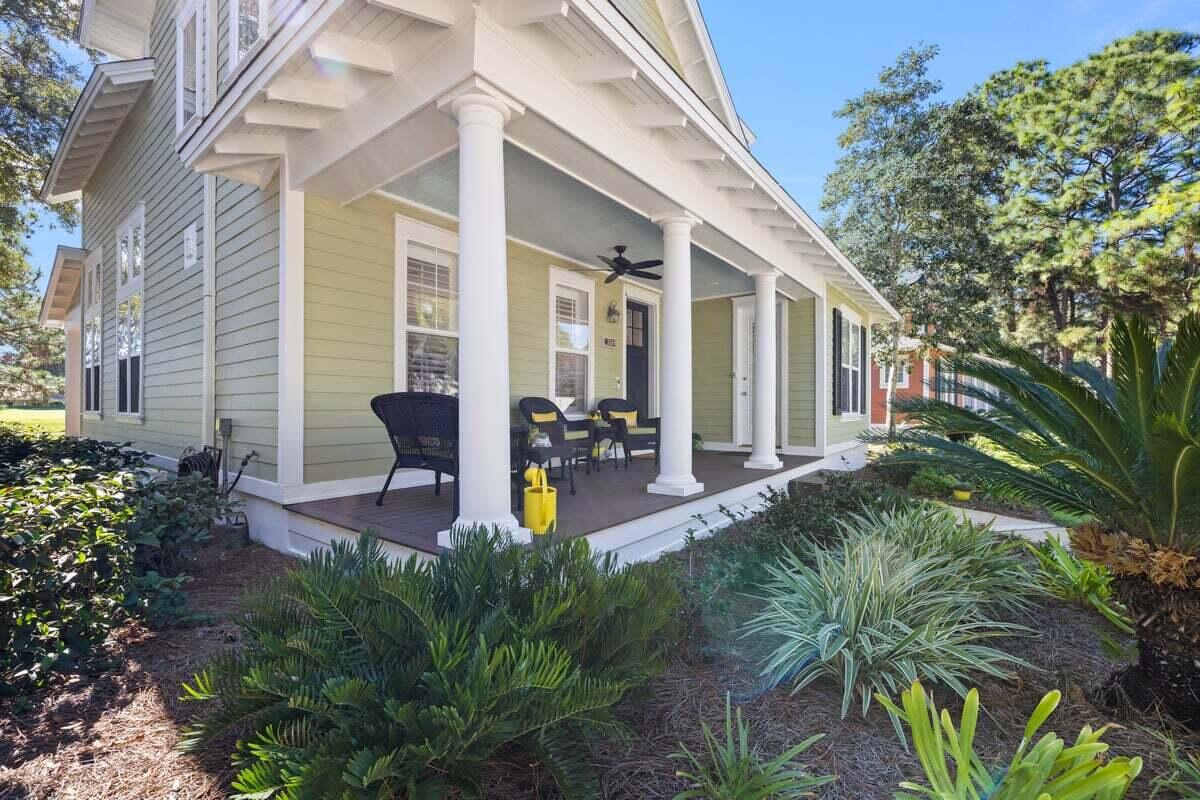 1281 Laurel Way Miramar Beach, FL 32550 - Photo 35 of 46 a view of a patio with chairs and potted plants