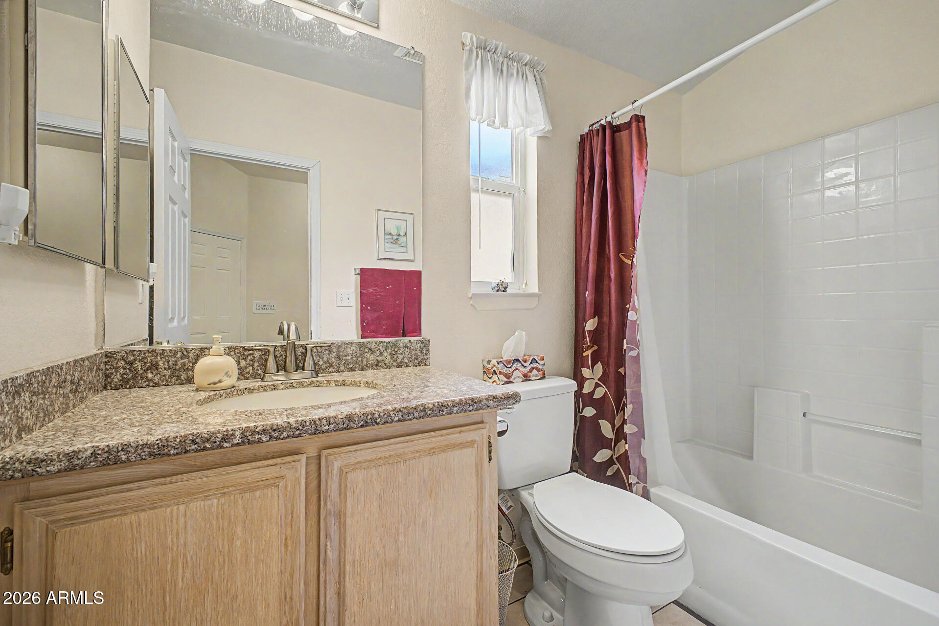 2101 South Meridian Road, Unit 45 Apache Junction, AZ 85120 - Photo 21 of 36 a bathroom with a granite countertop toilet sink and a mirror