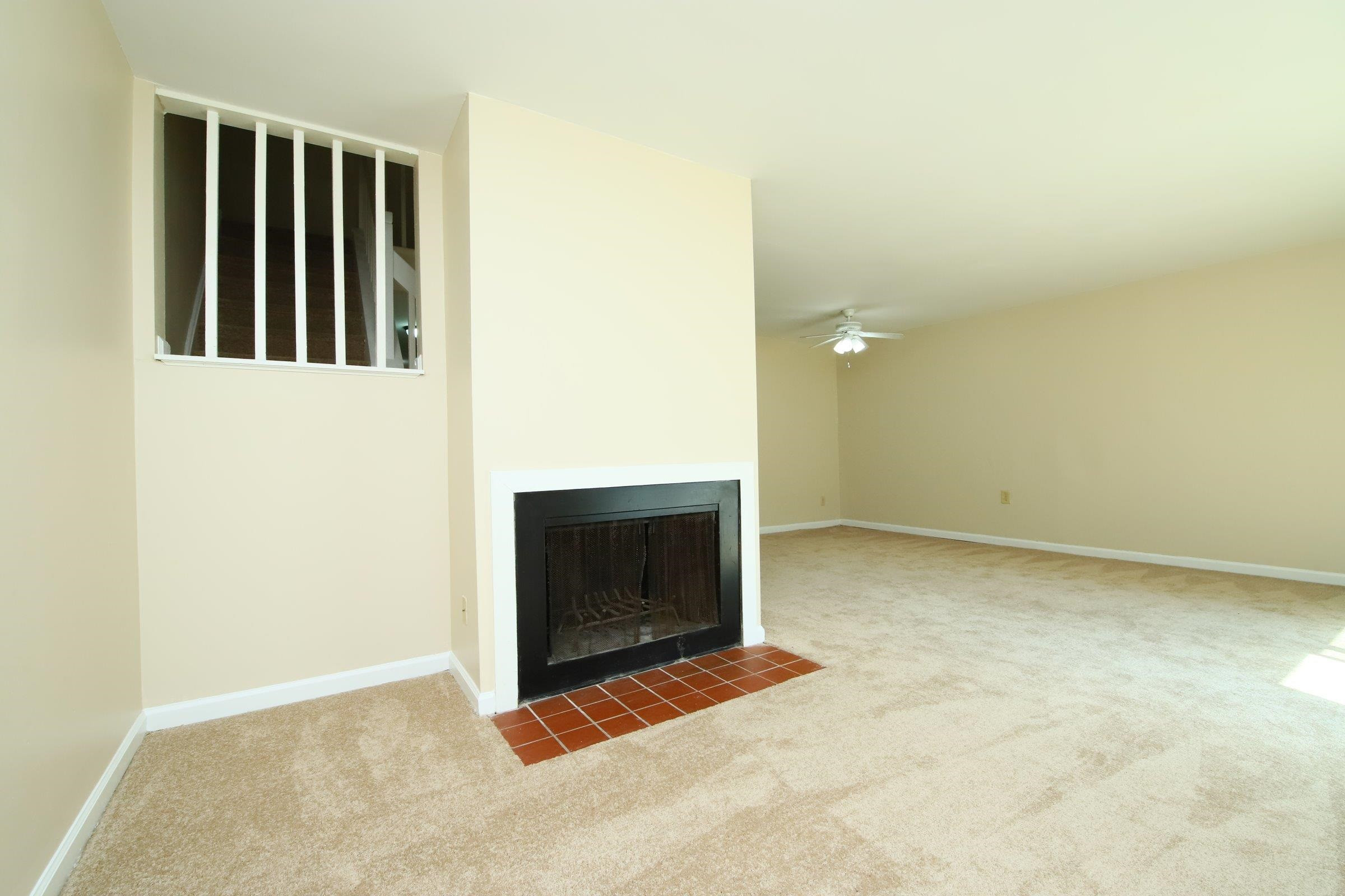 1227 Seaton Road, Unit 56 Durham, NC 27713 - Photo 11 of 30 a view of an empty room with a fireplace