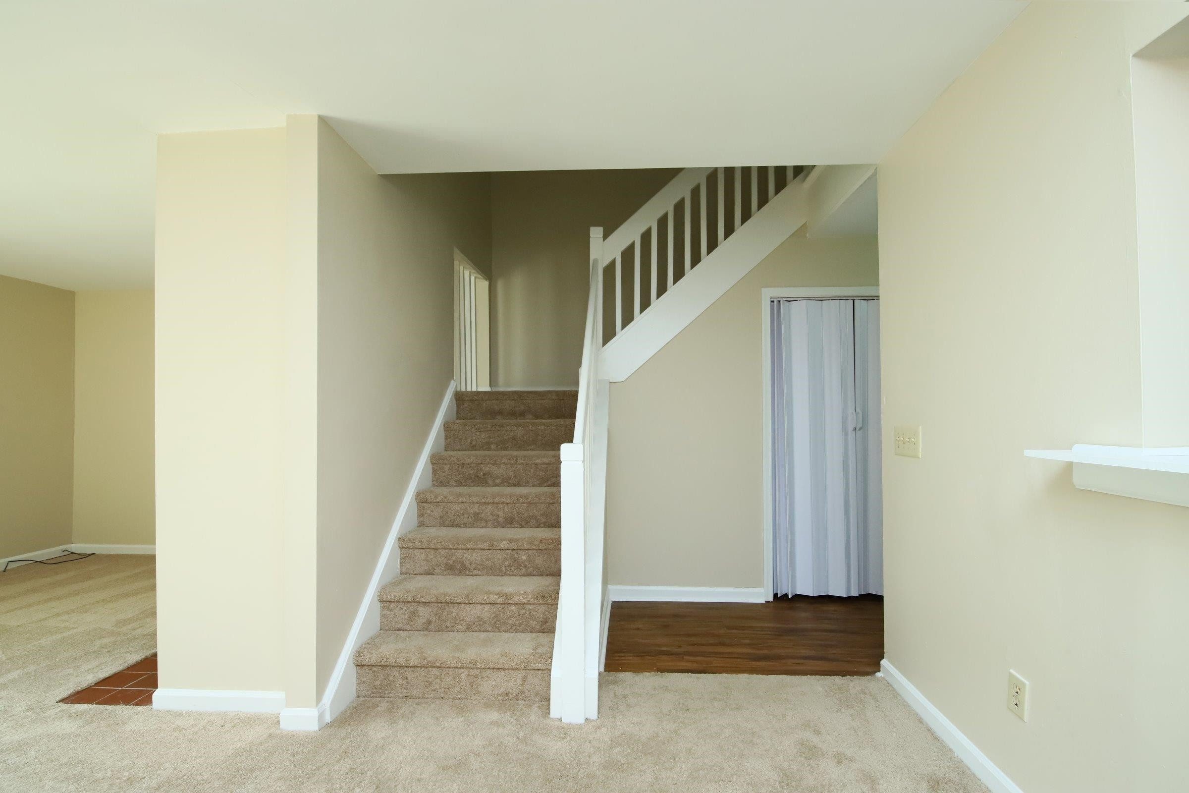 1227 Seaton Road, Unit 56 Durham, NC 27713 - Photo 14 of 30 a view of staircase with railing and white walls