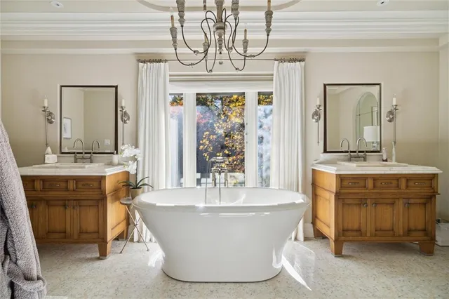 a view of living room with granite countertop a fireplace and a chandelier