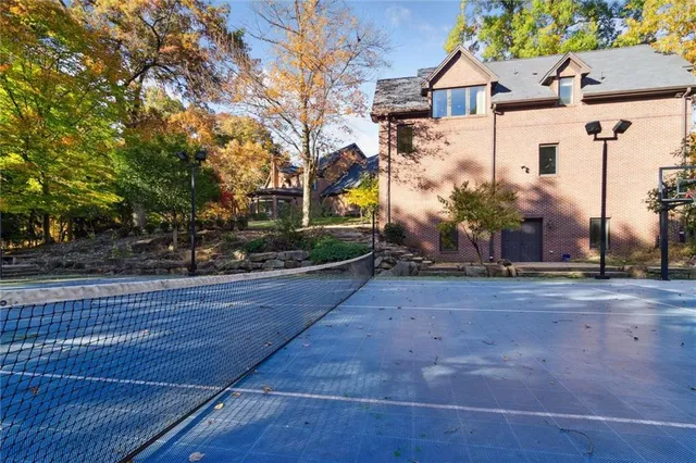 a view of yard with swimming pool and green space