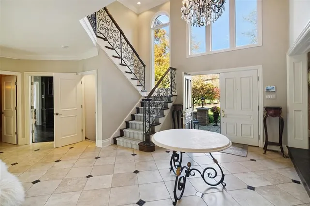 a view of a hallway with furniture and entryway