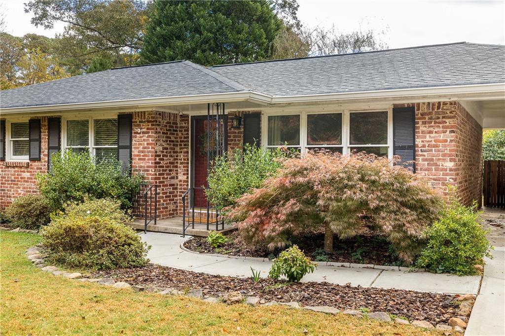 2485 Wood Trail Lane Decatur, GA 30033 - Photo 1 of 1 a front view of a house with garden