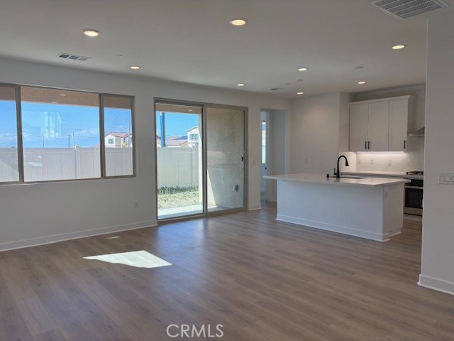 3710 Leafgreen Road Corona, CA 92883 - Photo 2 of 5 a kitchen with stainless steel appliances granite countertop a sink and a refrigerator