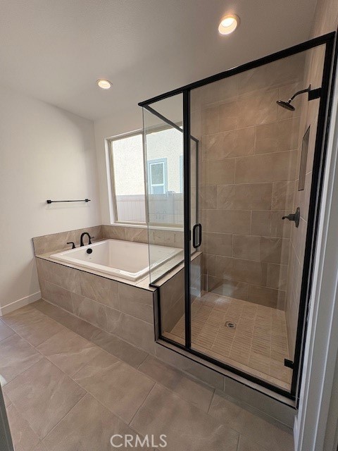 3710 Leafgreen Road Corona, CA 92883 - Photo 5 of 5 a bathroom with a bathtub and a shower