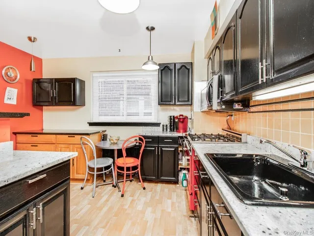 a kitchen that has a sink and a stove