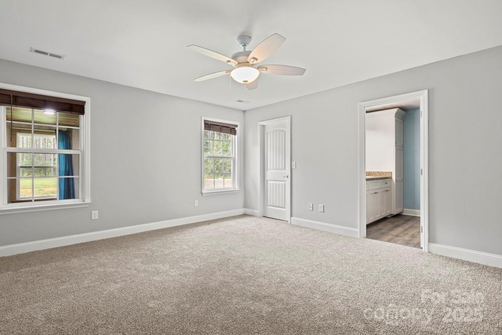 4268 Fletcher Funderburk Road Lancaster, SC 29720 - Photo 16 of 26 an empty room with windows and closet