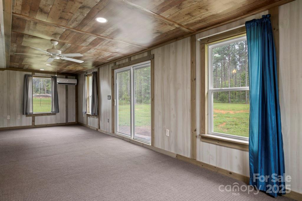 4268 Fletcher Funderburk Road Lancaster, SC 29720 - Photo 19 of 26 a view of a room with large windows