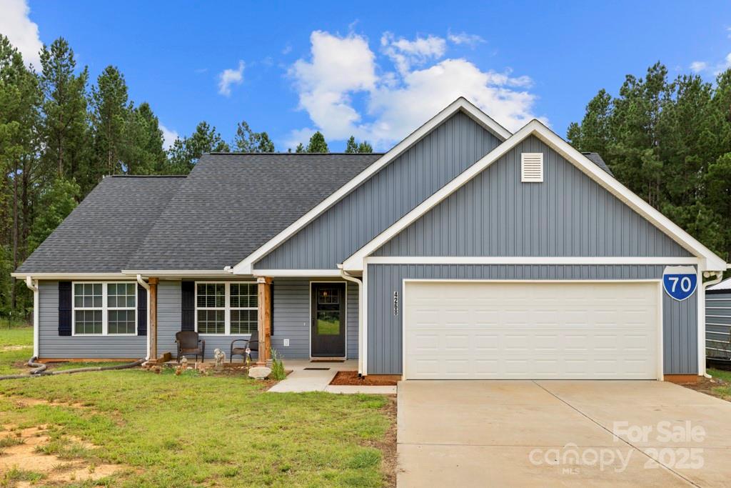 4268 Fletcher Funderburk Road Lancaster, SC 29720 - Photo 2 of 26 a front view of a house with a yard outdoor seating and garage