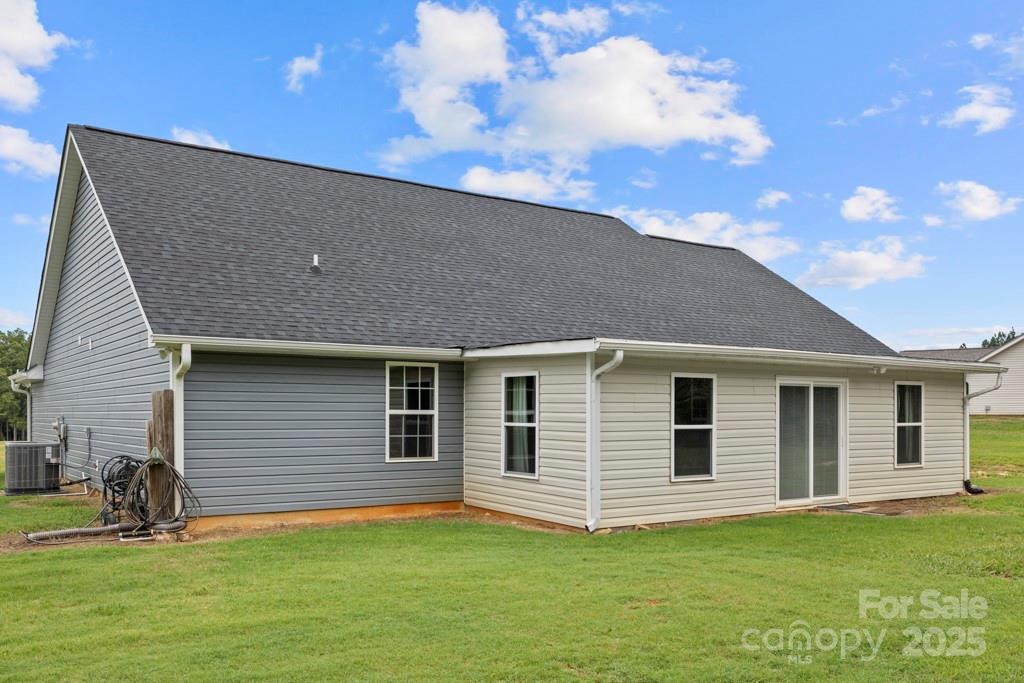 4268 Fletcher Funderburk Road Lancaster, SC 29720 - Photo 25 of 26 a backyard of a house with potted plants and large tree