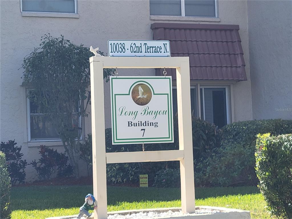 10038 62nd Avenue North, Unit 11 St. Petersburg, FL 33708 - Photo 37 of 43 a sign that is on the side of a building
