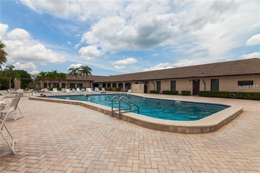 10038 62nd Avenue North, Unit 11 St. Petersburg, FL 33708 - Photo 43 of 43 a view of swimming pool with a yard