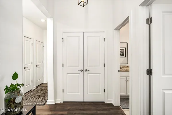 a view of an entryway with wooden floor