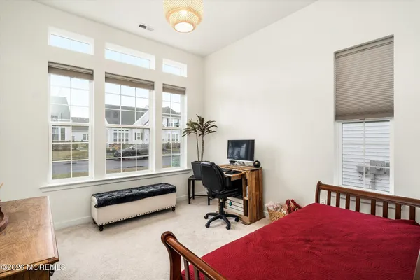 a reading room with furniture and a window