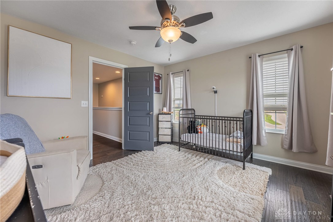 407 Brownstone Row Springboro, OH 45066 - Photo 34 of 54 This cozy bedroom features warm wood flooring.