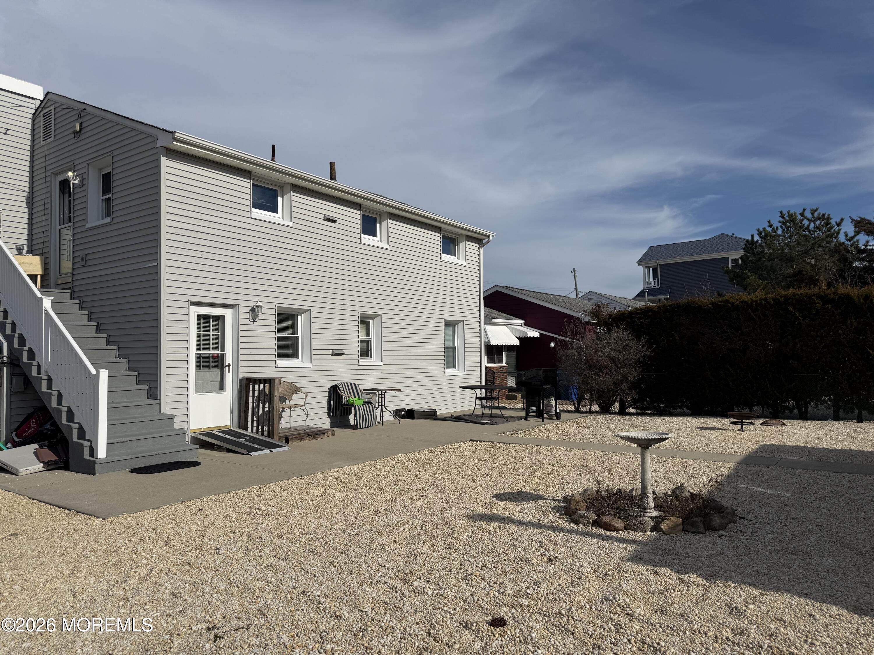 223 4th Avenue, Unit 2 Seaside Heights, NJ 08751 - Photo 2 of 2 a view of a terrace with wooden fence