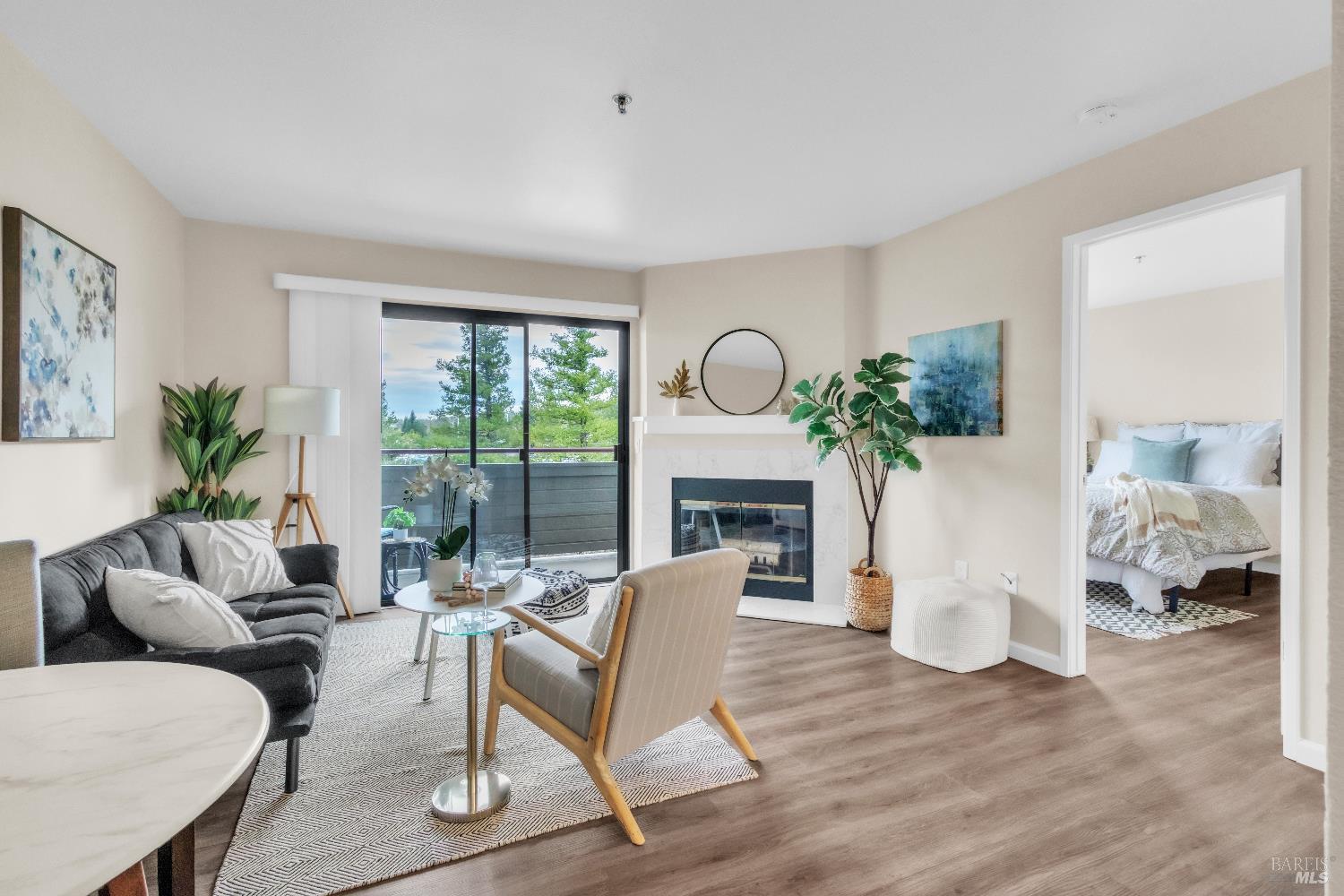 202 Mariner Way Novato, CA 94945 - Photo 1 of 27 a living room with furniture a fireplace and a floor to ceiling window