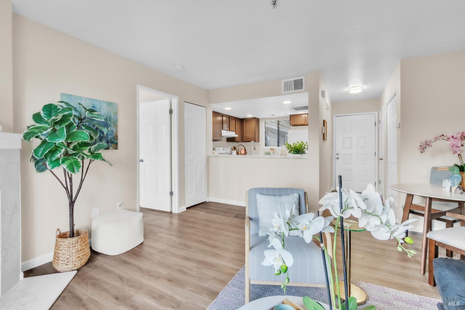 202 Mariner Way Novato, CA 94945 - Photo 3 of 27 a living room with furniture and a potted plant