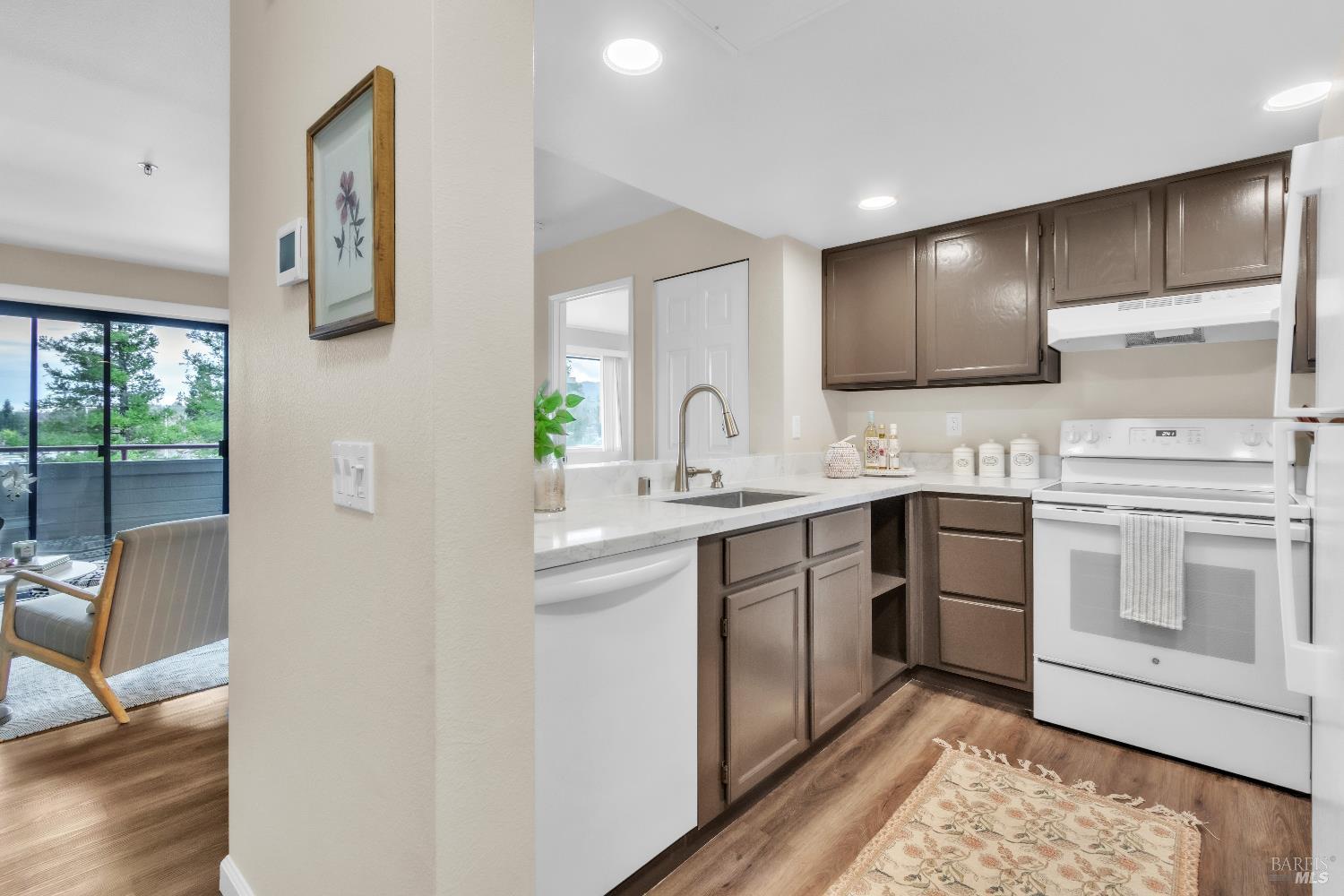 202 Mariner Way Novato, CA 94945 - Photo 6 of 27 a kitchen with a sink cabinets and window