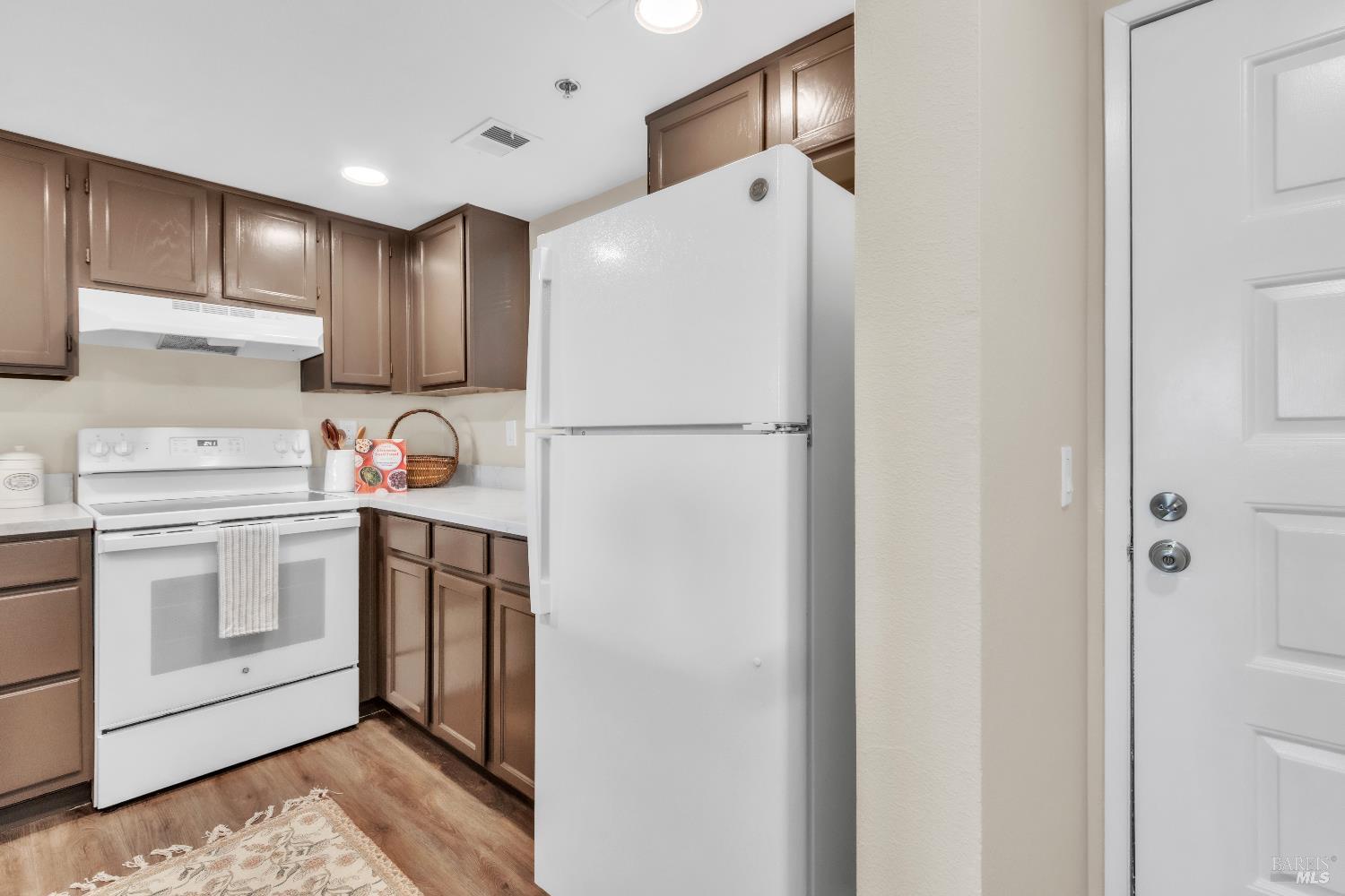 202 Mariner Way Novato, CA 94945 - Photo 8 of 27 a white refrigerator freezer sitting in a kitchen