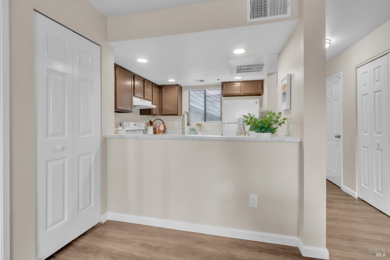 202 Mariner Way Novato, CA 94945 - Photo 9 of 27 a kitchen with stainless steel appliances granite countertop a refrigerator sink and cabinets