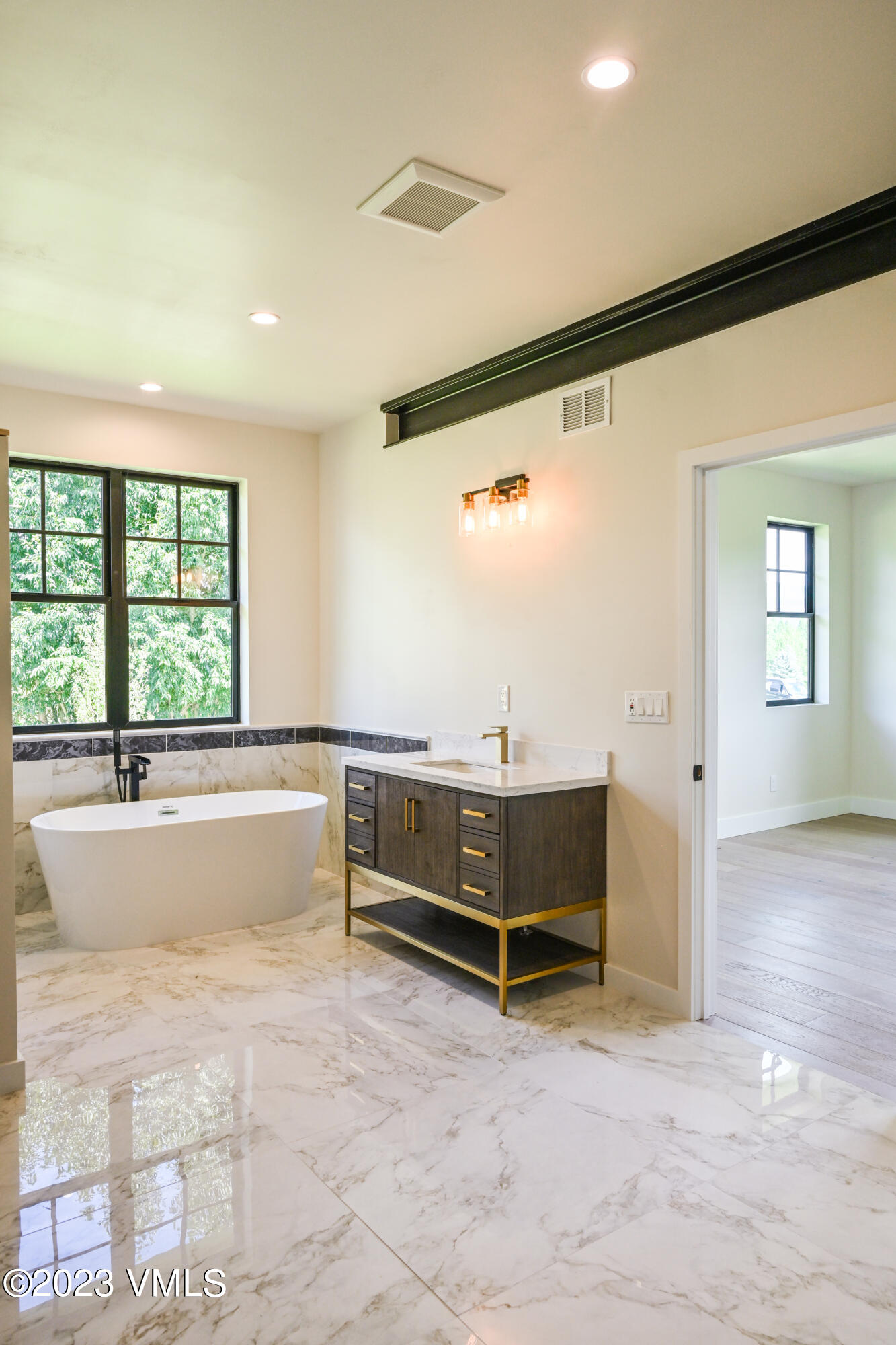 207 Aidan Road Eagle, CO 81631 - Photo 16 of 26 a view of a hardwood floor and window in an empty room