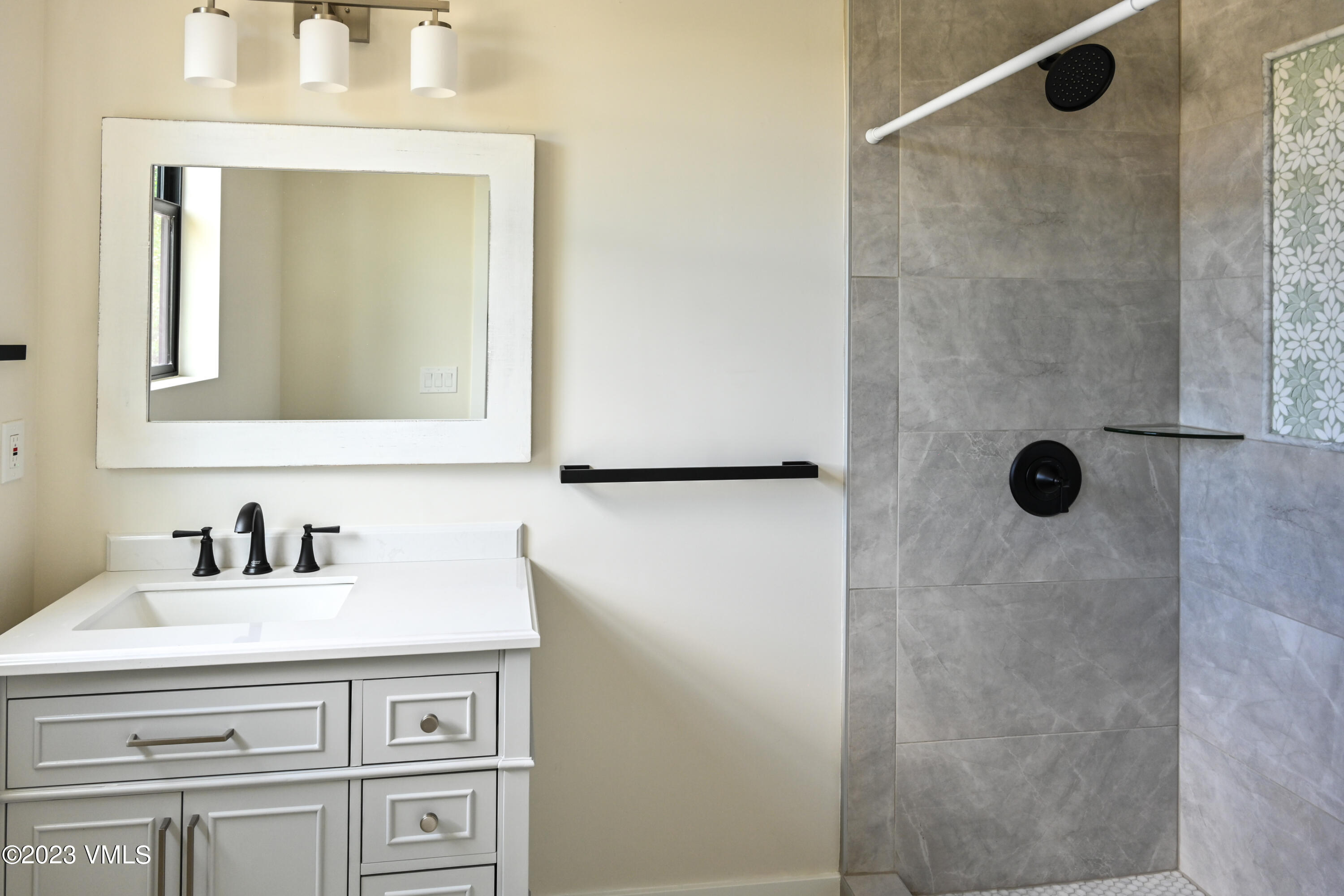 207 Aidan Road Eagle, CO 81631 - Photo 21 of 26 a bathroom with a sink and a mirror
