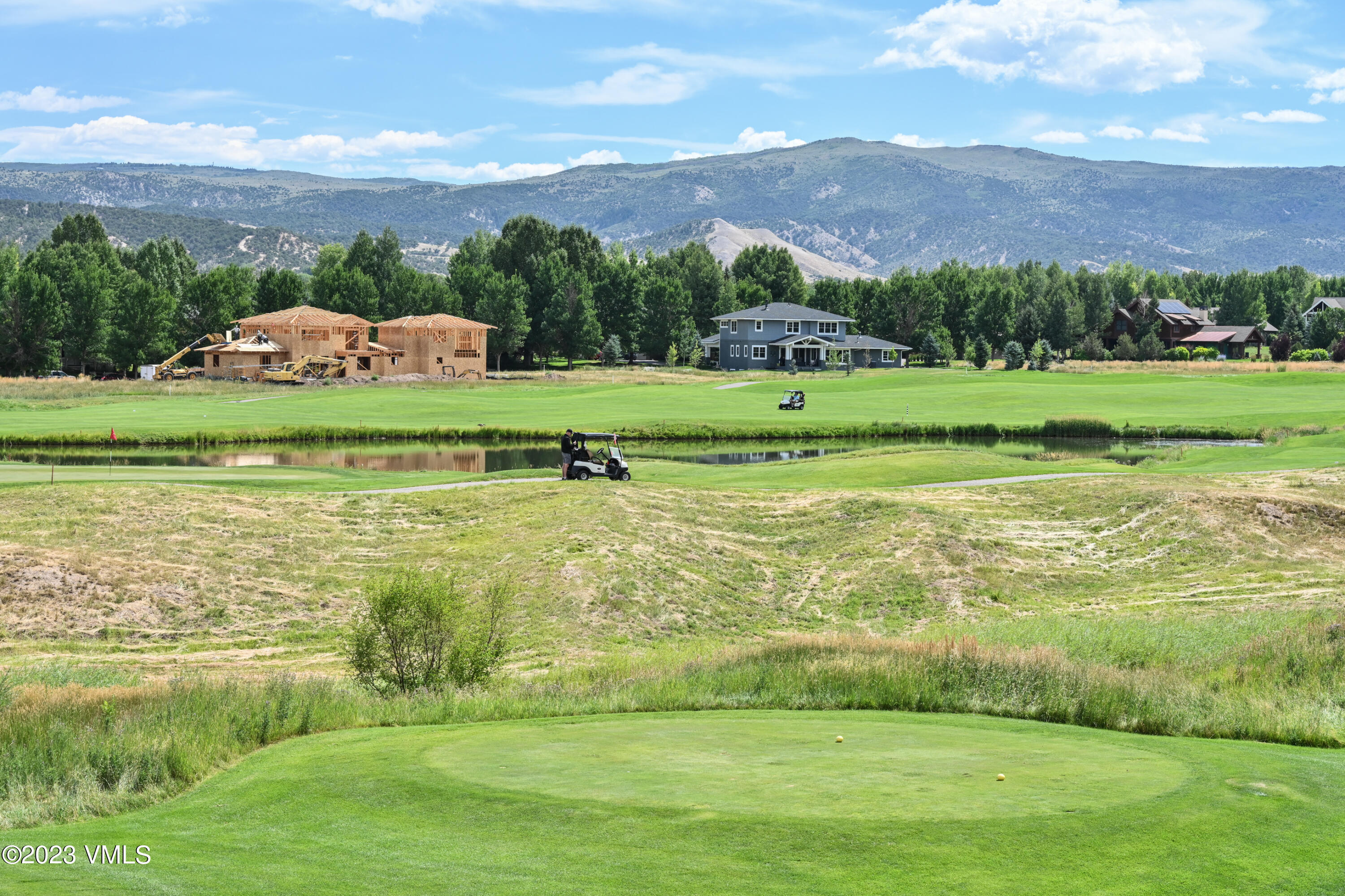 207 Aidan Road Eagle, CO 81631 - Photo 23 of 26 a view of a golf course with a lake
