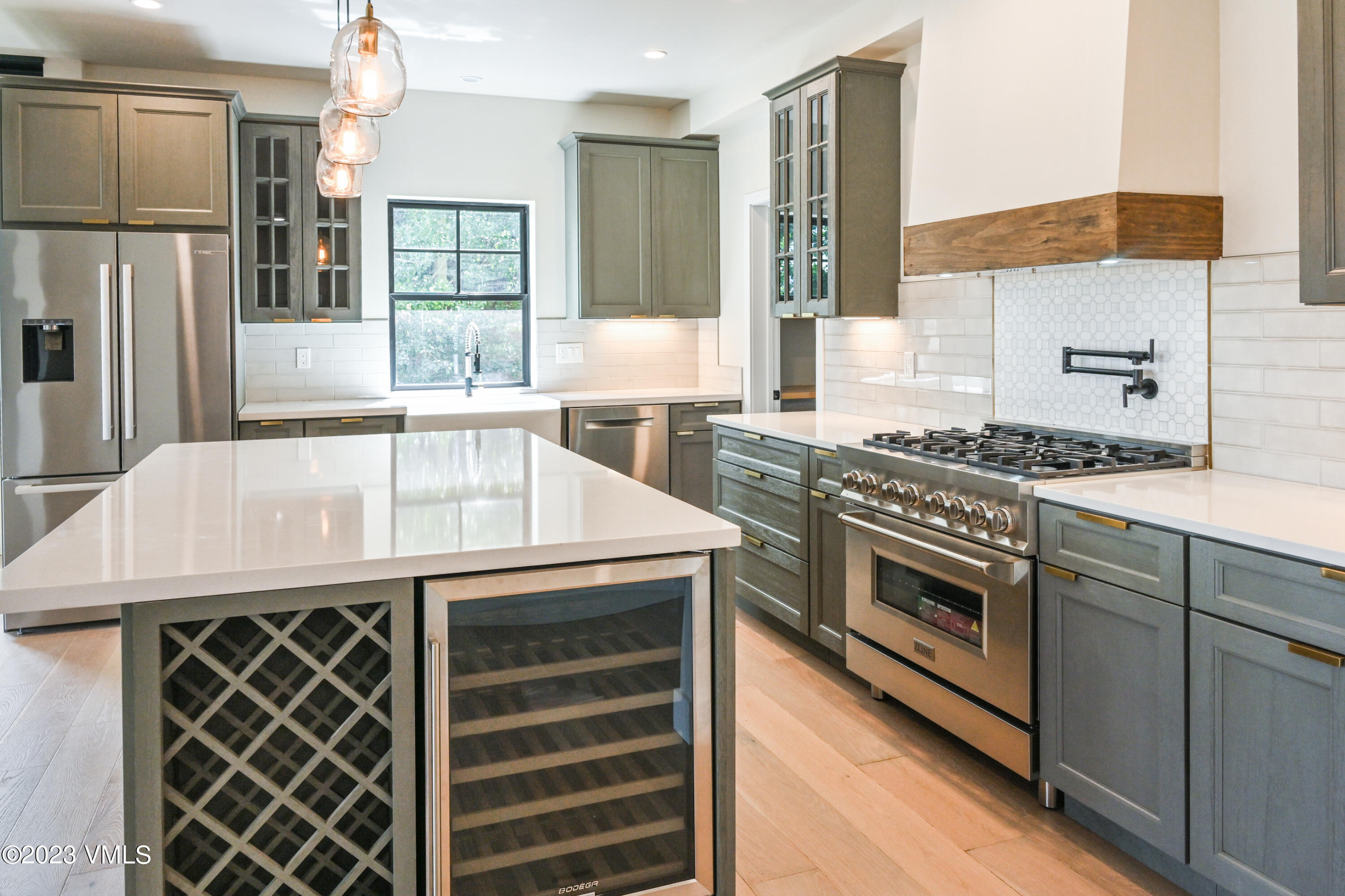 207 Aidan Road Eagle, CO 81631 - Photo 6 of 26 a kitchen with stainless steel appliances a stove a sink and a refrigerator