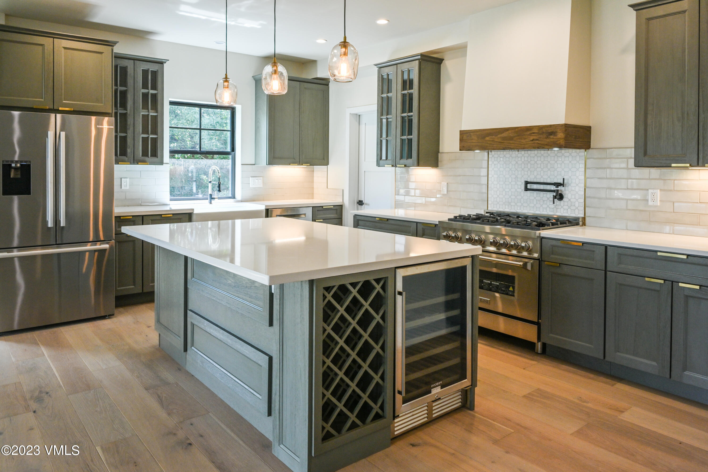 207 Aidan Road Eagle, CO 81631 - Photo 8 of 26 a kitchen with a stove sink and refrigerator