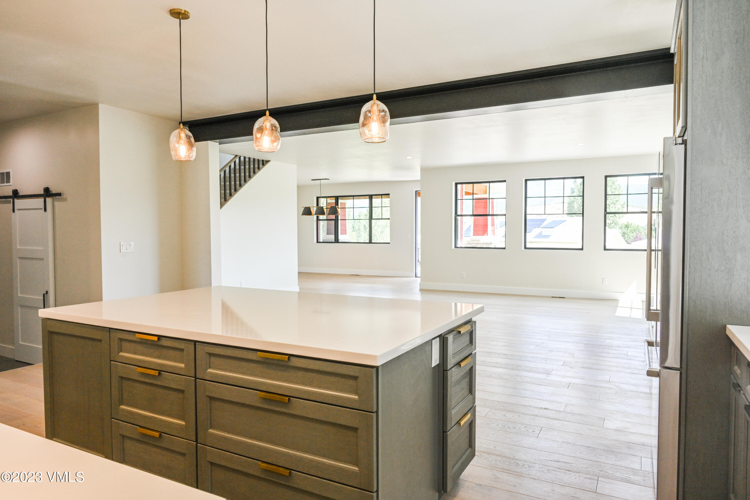 207 Aidan Road Eagle, CO 81631 - Photo 10 of 26 a kitchen with a sink and a mirror