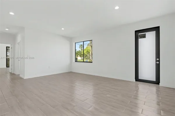 a view of an empty room with a window