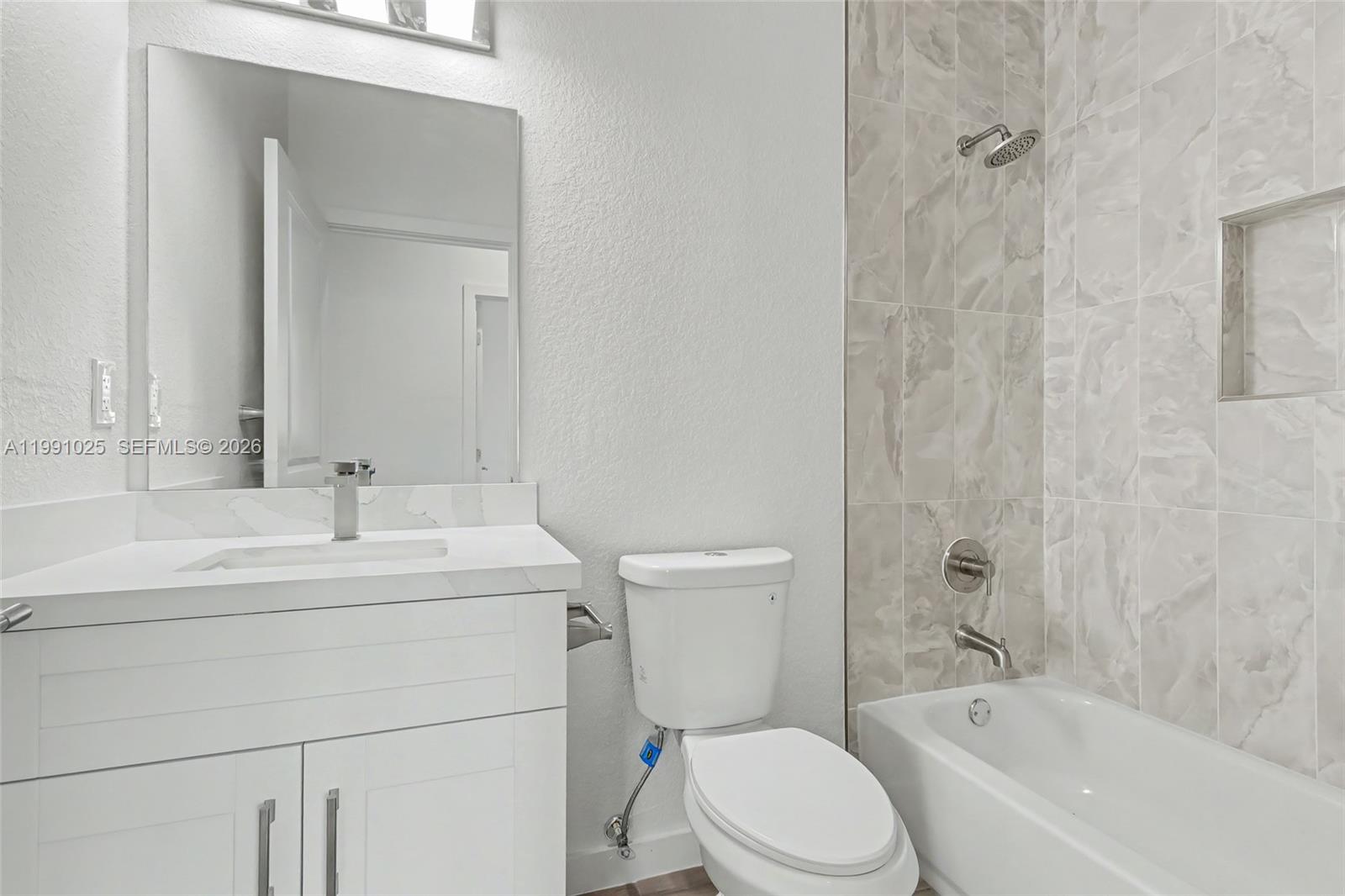 6140 Southwest 39th Street Miramar, FL 33023 - Photo 16 of 40 a bathroom with a sink toilet and shower