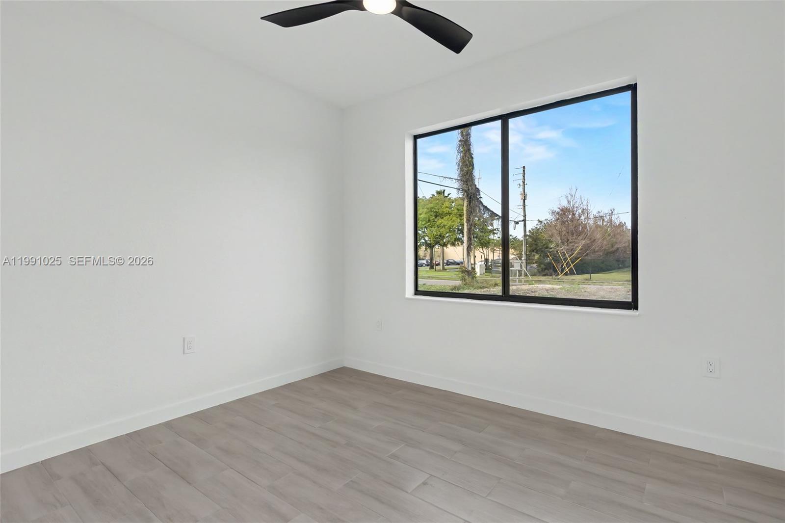 6140 Southwest 39th Street Miramar, FL 33023 - Photo 18 of 40 an empty room with a window