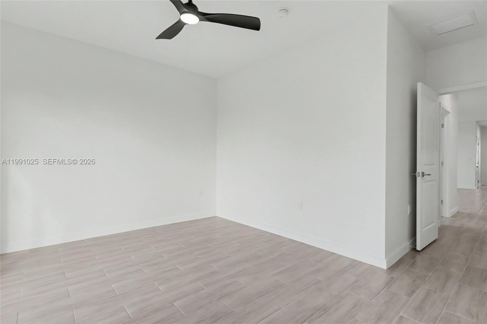 6140 Southwest 39th Street Miramar, FL 33023 - Photo 26 of 40 a view of a room with wooden floor