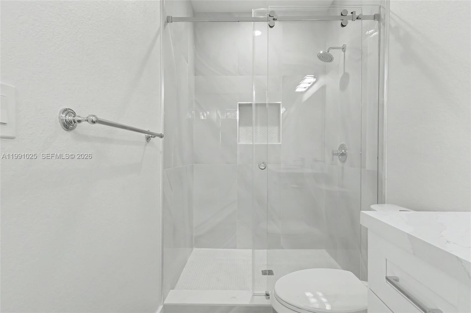 6140 Southwest 39th Street Miramar, FL 33023 - Photo 28 of 40 a bathroom with a shower a toilet and sink