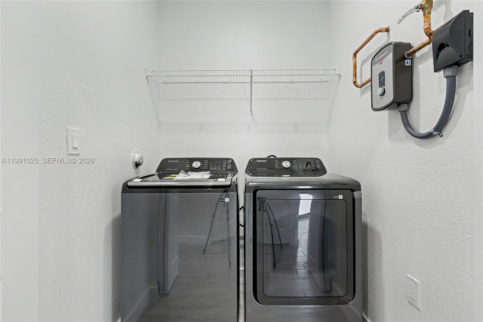 6140 Southwest 39th Street Miramar, FL 33023 - Photo 29 of 40 a utility room with dryer and washer