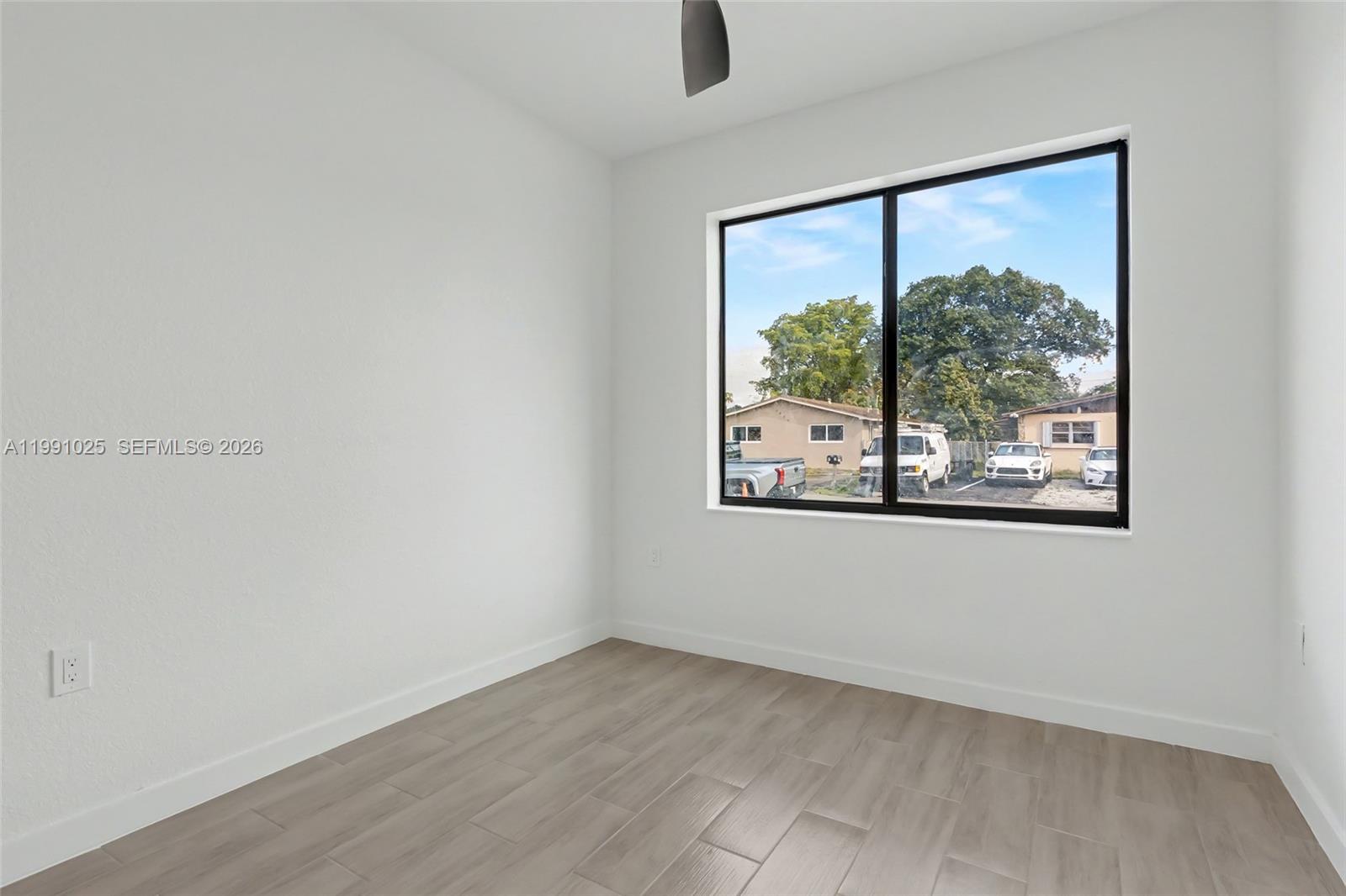 6140 Southwest 39th Street Miramar, FL 33023 - Photo 32 of 40 an empty room with a window