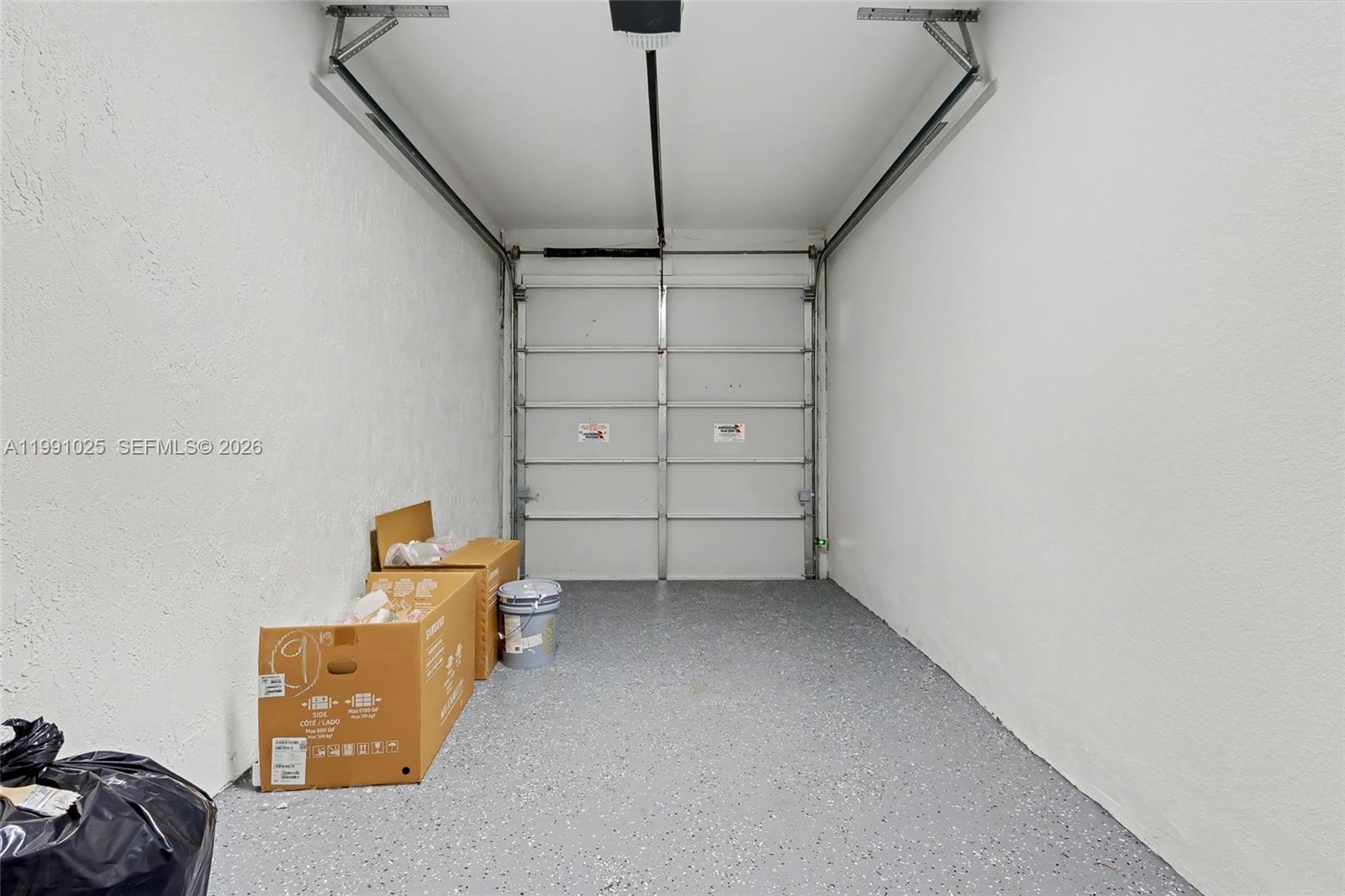 6140 Southwest 39th Street Miramar, FL 33023 - Photo 35 of 40 a view of a room with racks on the wall