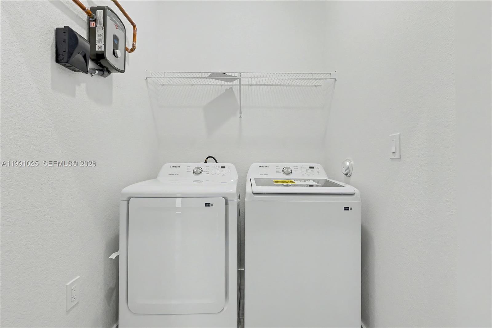 6140 Southwest 39th Street Miramar, FL 33023 - Photo 38 of 40 a utility room with dryer and washer