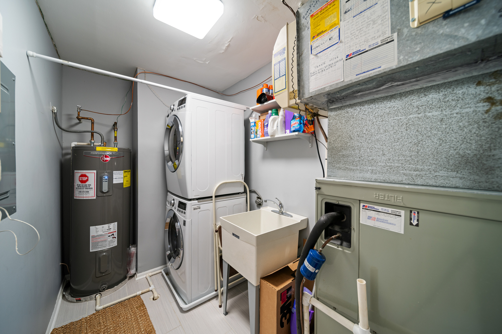 710 Ballantrae Drive, Unit B Northbrook, IL 60062 - Photo 22 of 28 a utility room with cabinets dryer and washer
